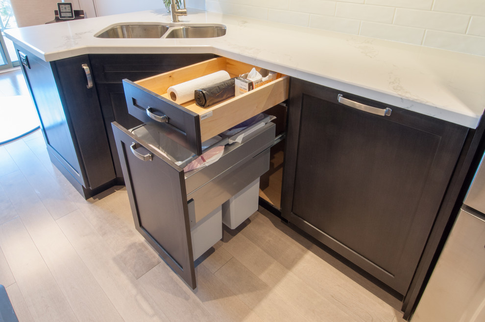 Example of a small minimalist galley dark wood floor eat-in kitchen design in Toronto with a double-bowl sink, shaker cabinets, dark wood cabinets, marble countertops, white backsplash, subway tile backsplash, stainless steel appliances and no island