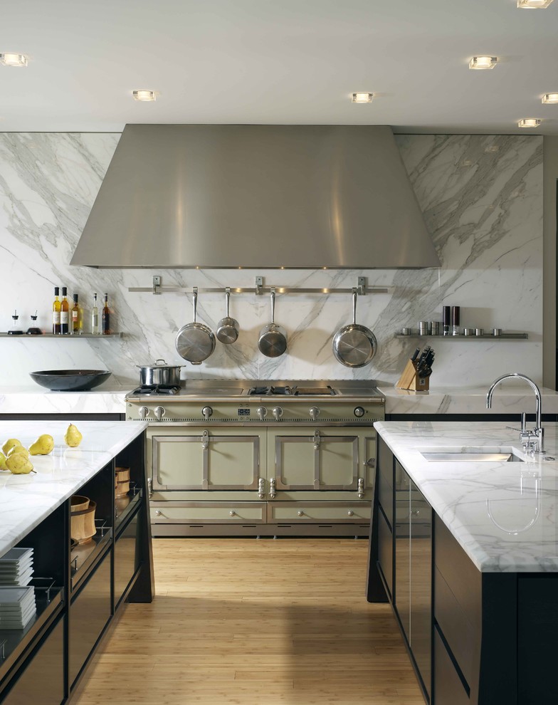 Kitchen - contemporary kitchen idea in Houston with colored appliances, black cabinets, white backsplash and marble backsplash