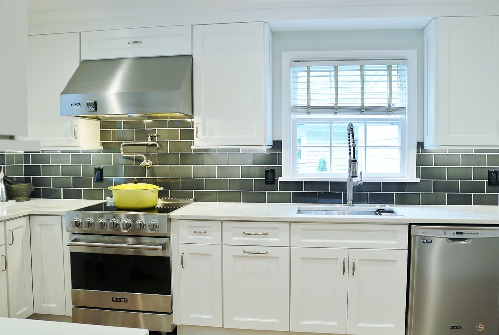 Example of a mid-sized transitional kitchen pantry design in New York