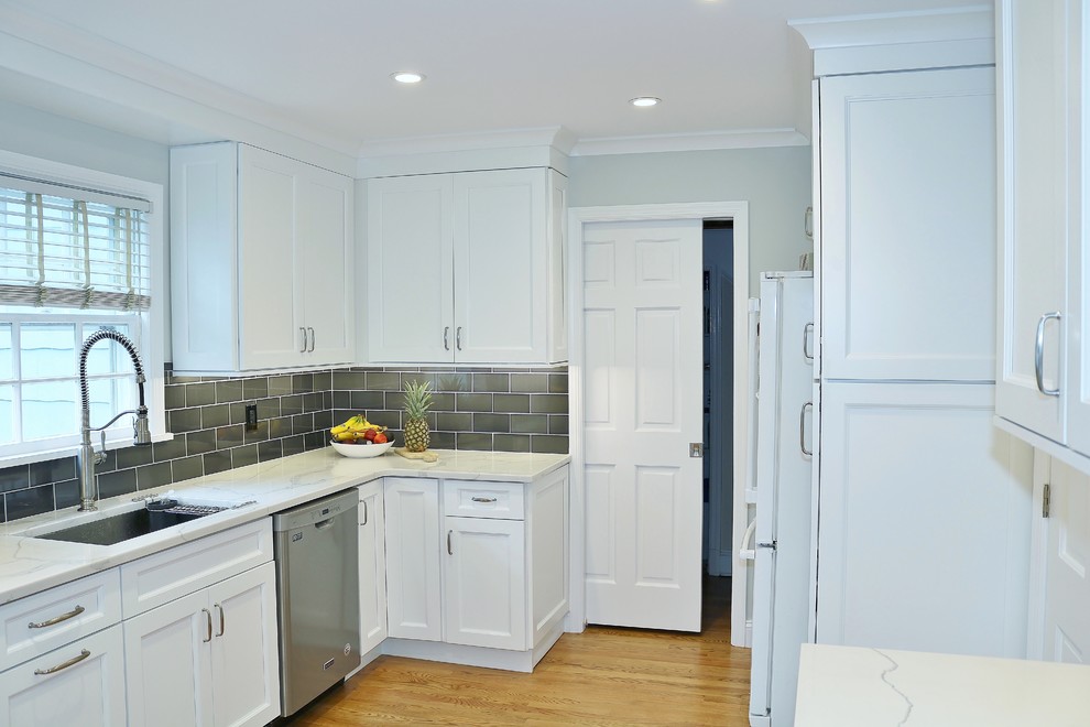 Example of a mid-sized transitional kitchen pantry design in New York