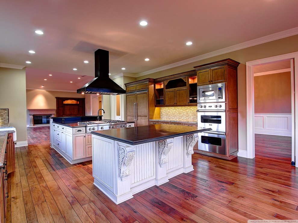 Eat-in kitchen - large medium tone wood floor eat-in kitchen idea in Miami