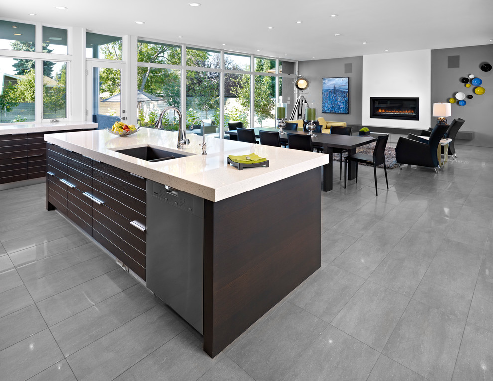 Design ideas for a contemporary l-shaped open plan kitchen in Edmonton with flat-panel cabinets, dark wood cabinets and grey floors.