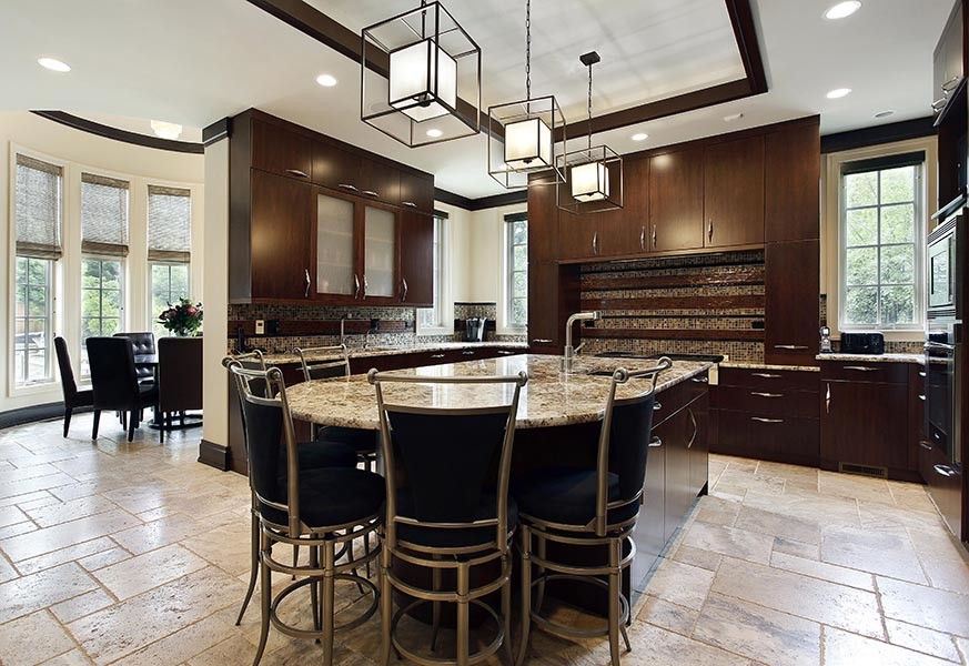 Example of a large minimalist u-shaped travertine floor and beige floor eat-in kitchen design in New York with an undermount sink, flat-panel cabinets, dark wood cabinets, granite countertops, multicolored backsplash, mosaic tile backsplash and an island
