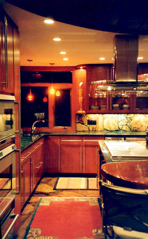 Foto di una piccola cucina moderna chiusa con lavello a doppia vasca, ante di vetro, ante in legno bruno, top in granito, paraspruzzi multicolore, paraspruzzi in lastra di pietra, elettrodomestici in acciaio inossidabile e pavimento in pietra calcarea
