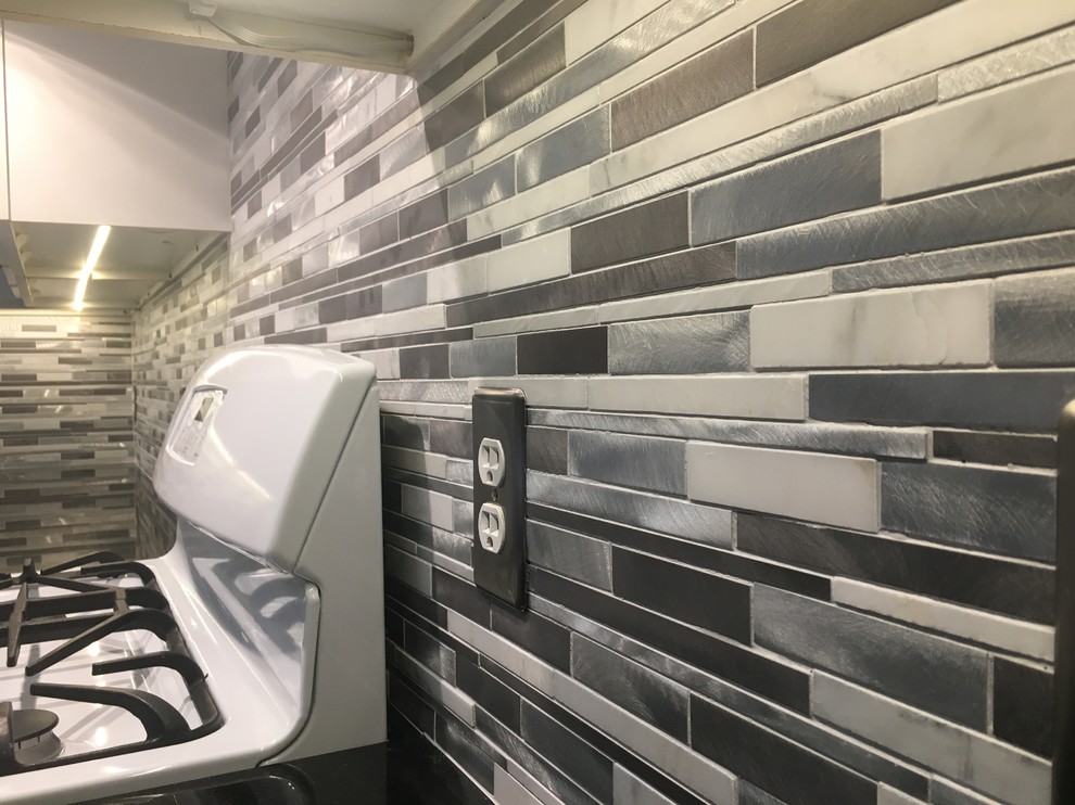 Trendy kitchen photo in Austin with multicolored backsplash, mosaic tile backsplash and white appliances