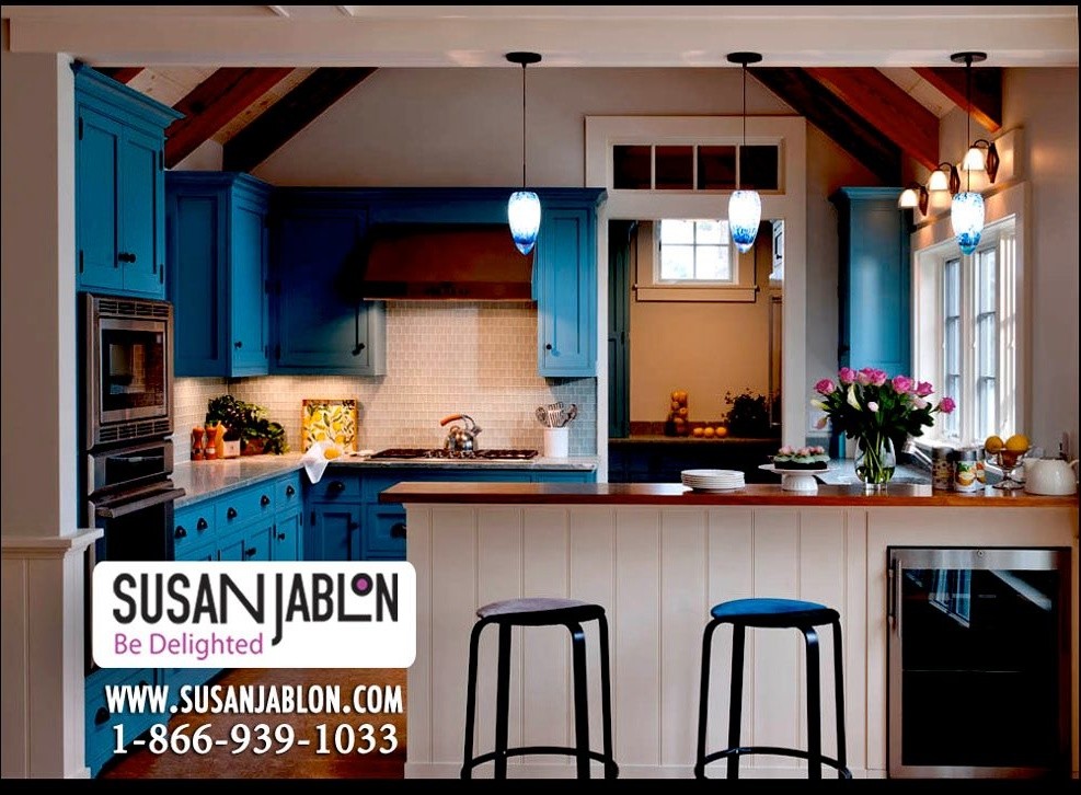 Kitchen pantry - mid-sized farmhouse l-shaped kitchen pantry idea in New York with a double-bowl sink, recessed-panel cabinets, blue cabinets, quartzite countertops, white backsplash, glass tile backsplash, stainless steel appliances and a peninsula
