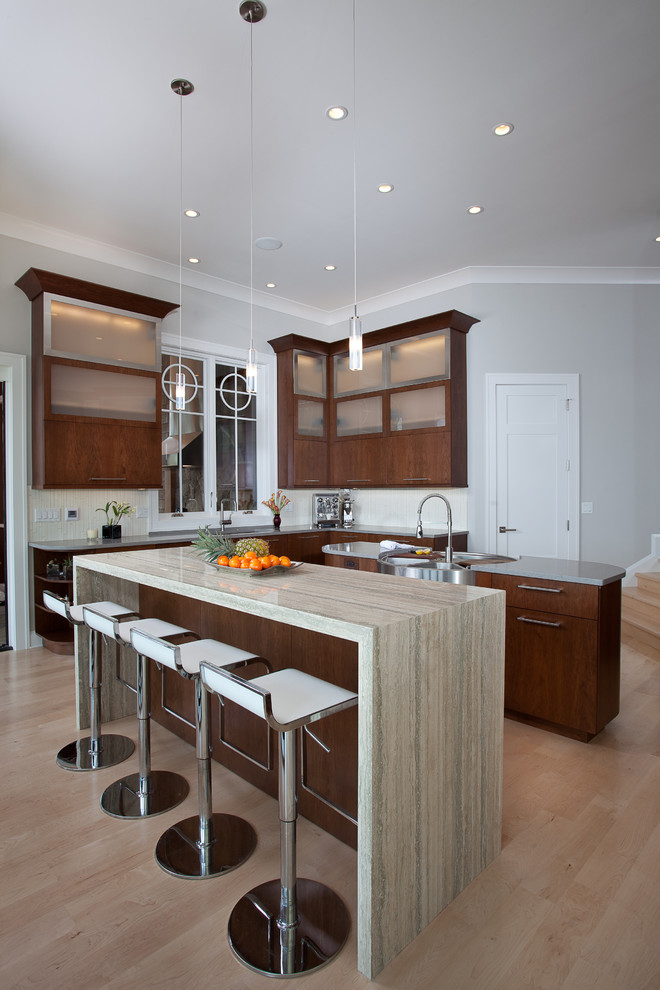 Inspiration for a contemporary kitchen remodel in San Francisco with an integrated sink, flat-panel cabinets and dark wood cabinets