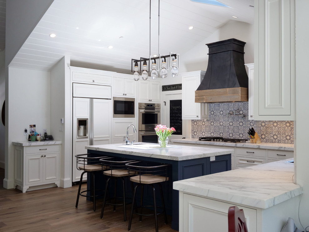 Kitchen - large country u-shaped dark wood floor and brown floor kitchen idea in San Francisco with an undermount sink, beaded inset cabinets, white cabinets, marble countertops, multicolored backsplash, cement tile backsplash, paneled appliances, an island and white countertops