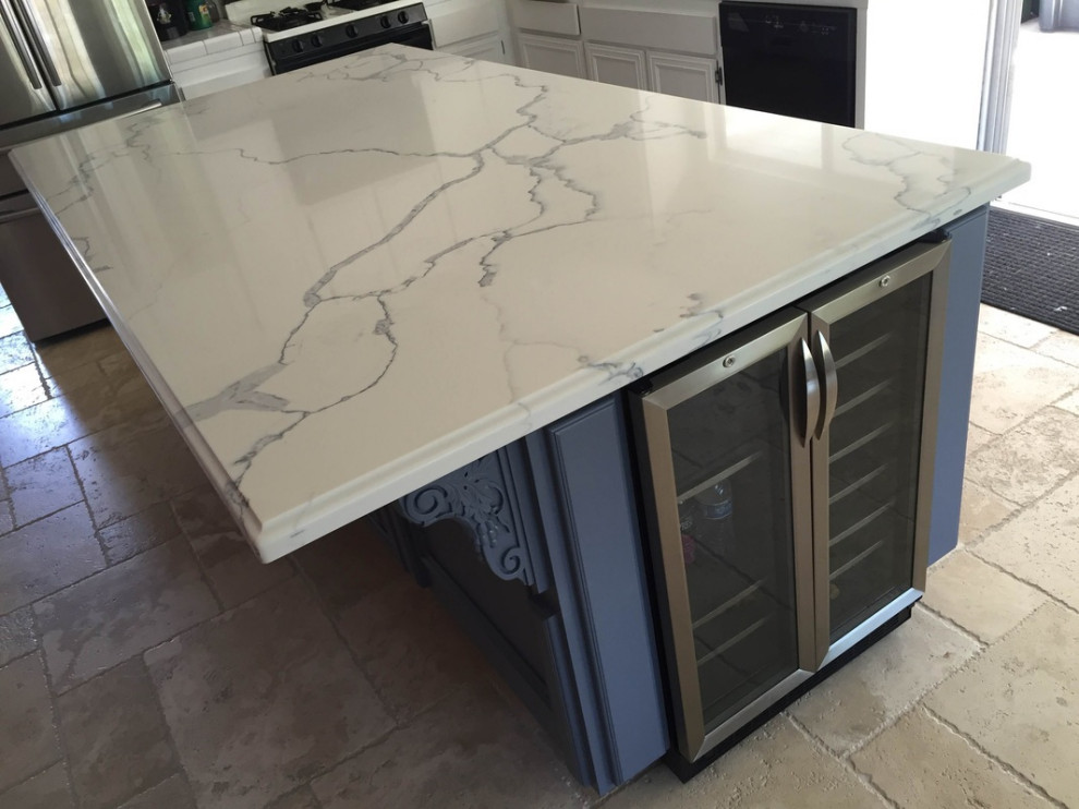 Kitchen blue island with Calacatta Gold Quartz countertops