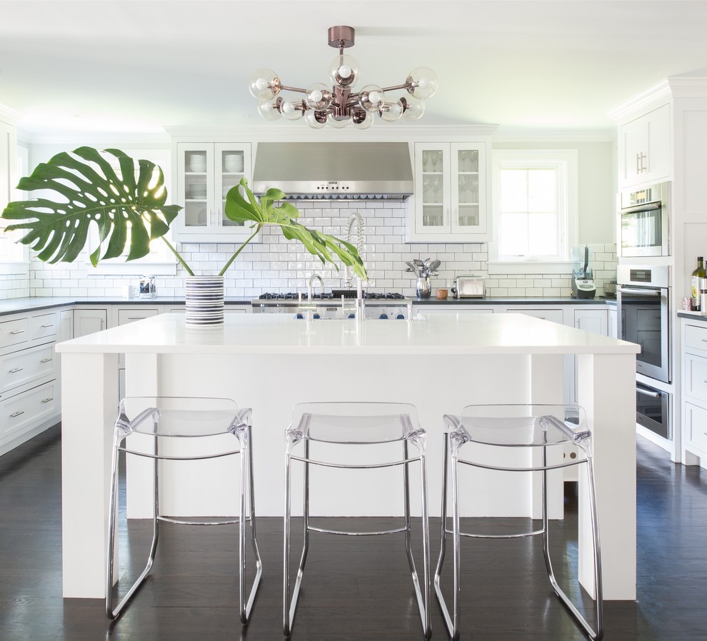 Design ideas for a country u-shaped open plan kitchen in New York with shaker cabinets, white cabinets, engineered stone countertops, white splashback and an island.