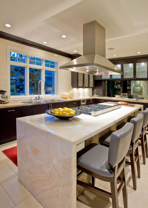 Inspiration for a contemporary kitchen remodel in Seattle with dark wood cabinets, onyx countertops, white backsplash and subway tile backsplash