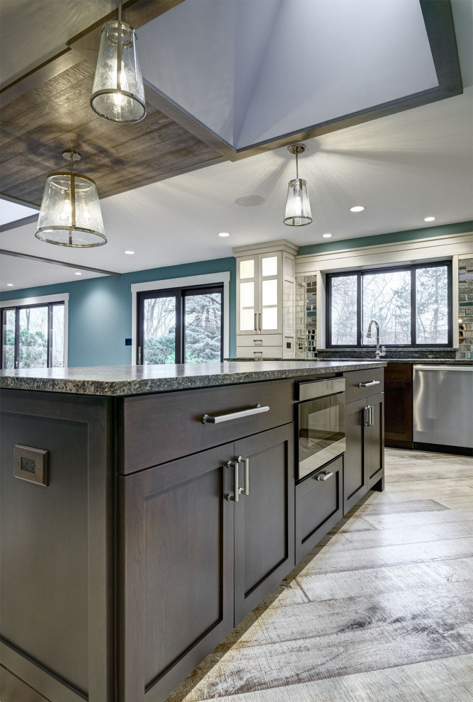Photo of a medium sized traditional u-shaped kitchen/diner in Chicago with wood worktops, light hardwood flooring, an island, white floors and a wood ceiling.