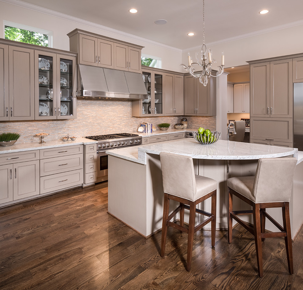 Example of a large transitional l-shaped dark wood floor open concept kitchen design in Houston with a double-bowl sink, granite countertops, multicolored backsplash, stone tile backsplash, stainless steel appliances, an island, raised-panel cabinets and beige cabinets