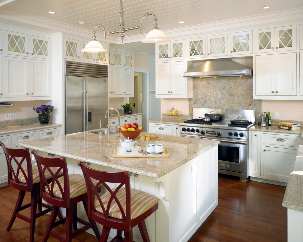 Example of a large country u-shaped dark wood floor and brown floor open concept kitchen design in Boston with an undermount sink, flat-panel cabinets, white cabinets, granite countertops, multicolored backsplash, marble backsplash, stainless steel appliances and an island