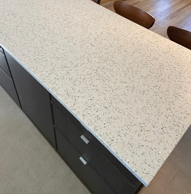 Kitchen countertops featuring Curava recycled glass surfaces in Savaii Fusion Kitchen