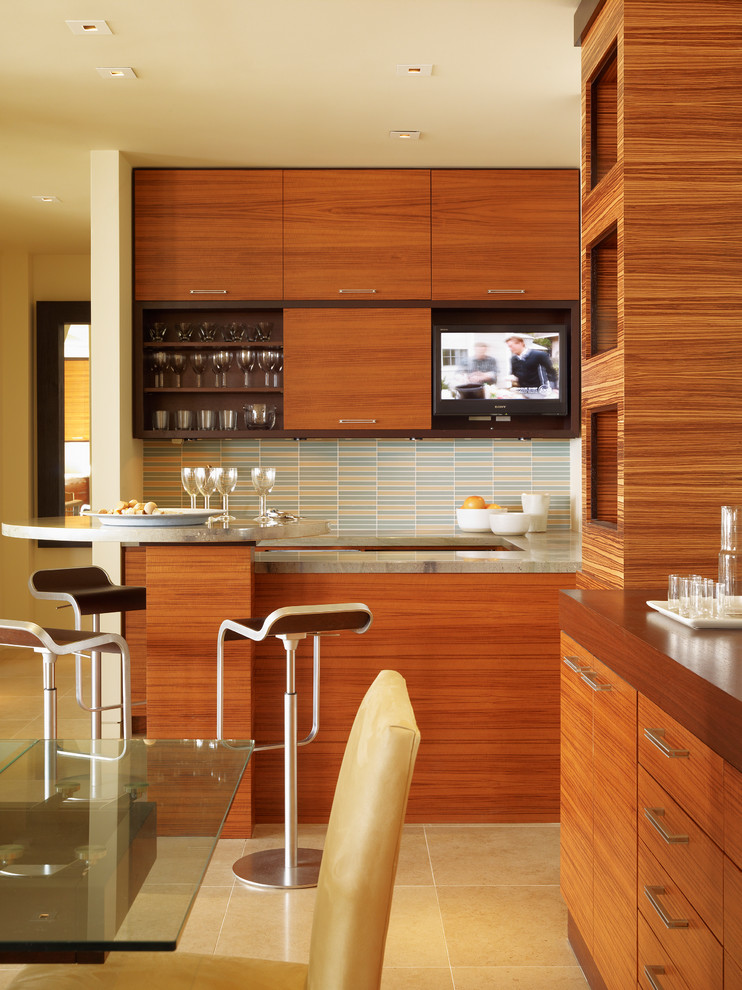 Mid-sized trendy eat-in kitchen photo in San Francisco with an undermount sink, flat-panel cabinets, medium tone wood cabinets, granite countertops, multicolored backsplash, glass tile backsplash, paneled appliances and a peninsula