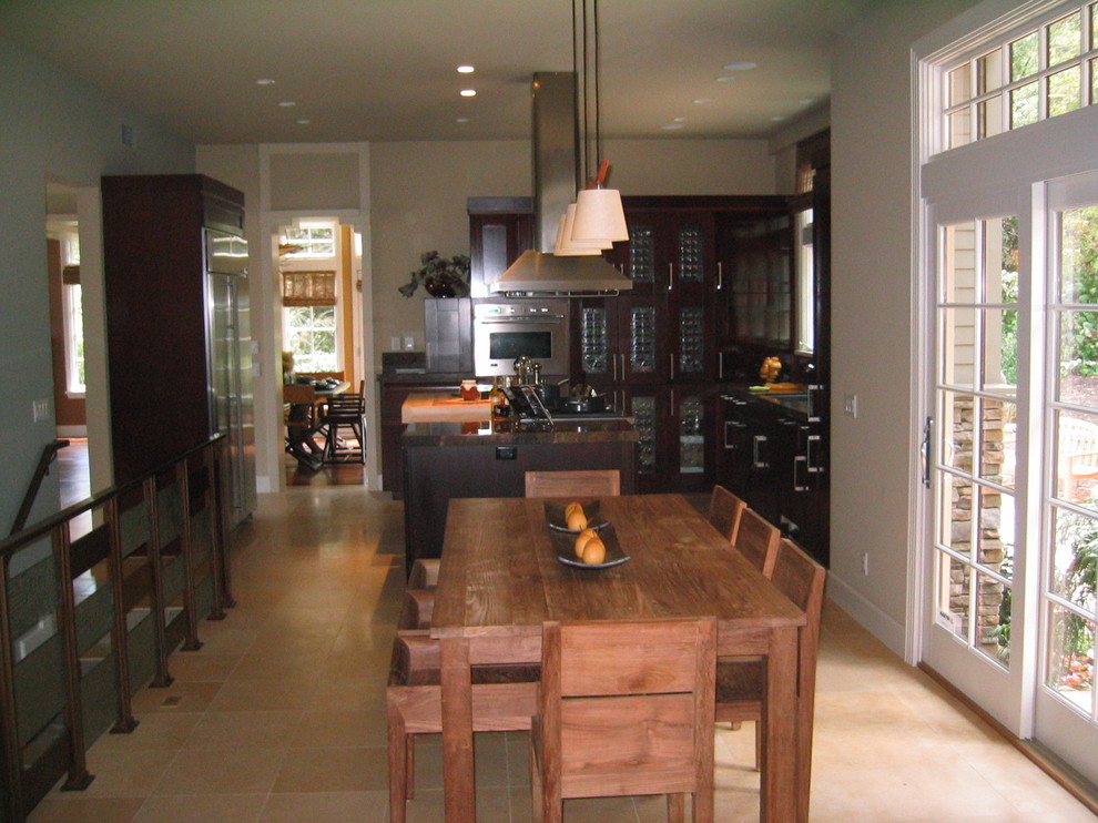 Immagine di una cucina abitabile contemporanea di medie dimensioni con lavello sottopiano, ante di vetro, ante in legno bruno, top in granito, elettrodomestici in acciaio inossidabile e pavimento in gres porcellanato