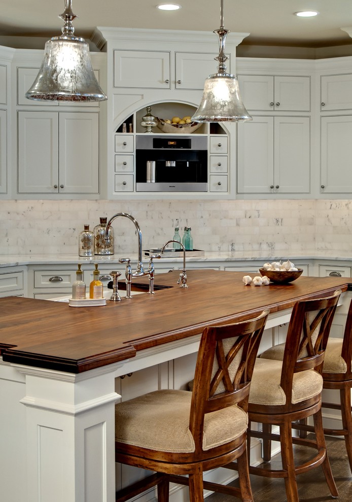 Photo of a traditional kitchen in Minneapolis with wood worktops.