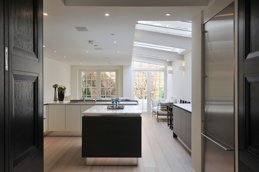Contemporary kitchen in Gloucestershire with stainless steel appliances.