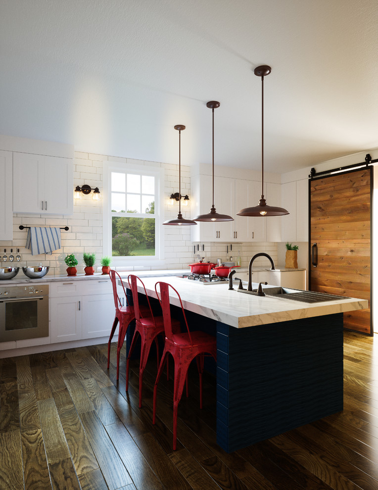 Eat-in kitchen - large farmhouse single-wall dark wood floor and brown floor eat-in kitchen idea in Milwaukee with a single-bowl sink, shaker cabinets, white cabinets, marble countertops, white backsplash, subway tile backsplash, stainless steel appliances and an island