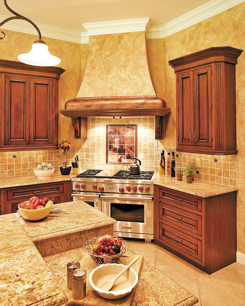 Eat-in kitchen - traditional ceramic tile eat-in kitchen idea in Bridgeport with beaded inset cabinets, medium tone wood cabinets, granite countertops, beige backsplash, cement tile backsplash, stainless steel appliances and an island