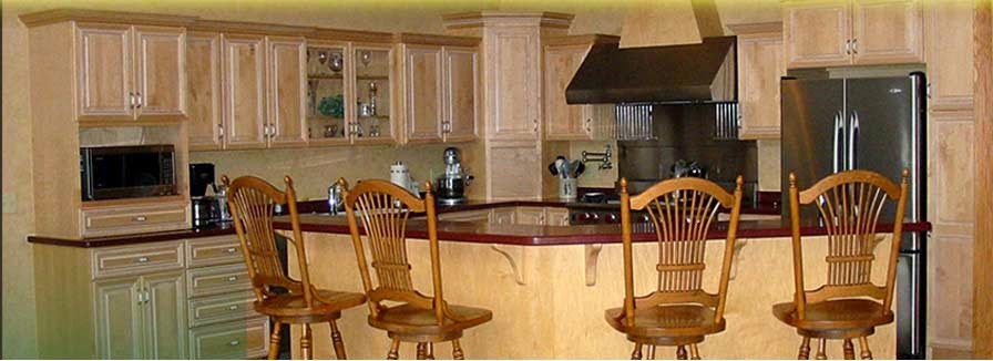 Example of a mid-sized trendy l-shaped eat-in kitchen design in New York with raised-panel cabinets, medium tone wood cabinets, solid surface countertops, stainless steel appliances and an island
