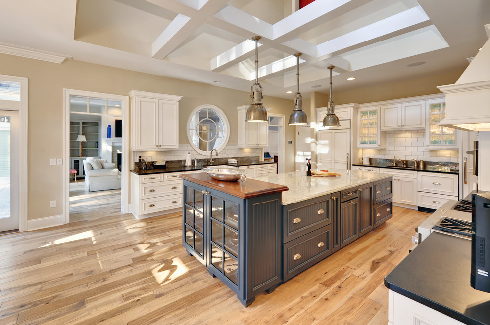 Inspiration for a coastal kitchen remodel in Philadelphia with recessed-panel cabinets and subway tile backsplash