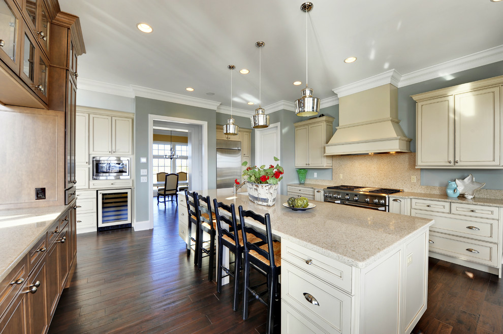 Inspiration for a contemporary enclosed kitchen remodel in Philadelphia with beaded inset cabinets, beige cabinets, beige backsplash and stainless steel appliances