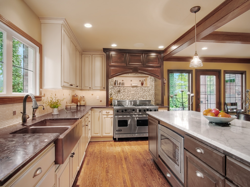 Kitchen - traditional kitchen idea in Seattle with stainless steel appliances and a farmhouse sink
