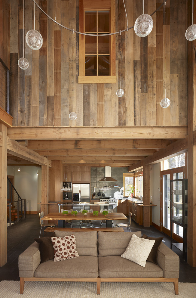 Inspiration for a rustic l-shaped open plan kitchen in Denver with flat-panel cabinets, medium wood cabinets, grey splashback and stainless steel appliances.