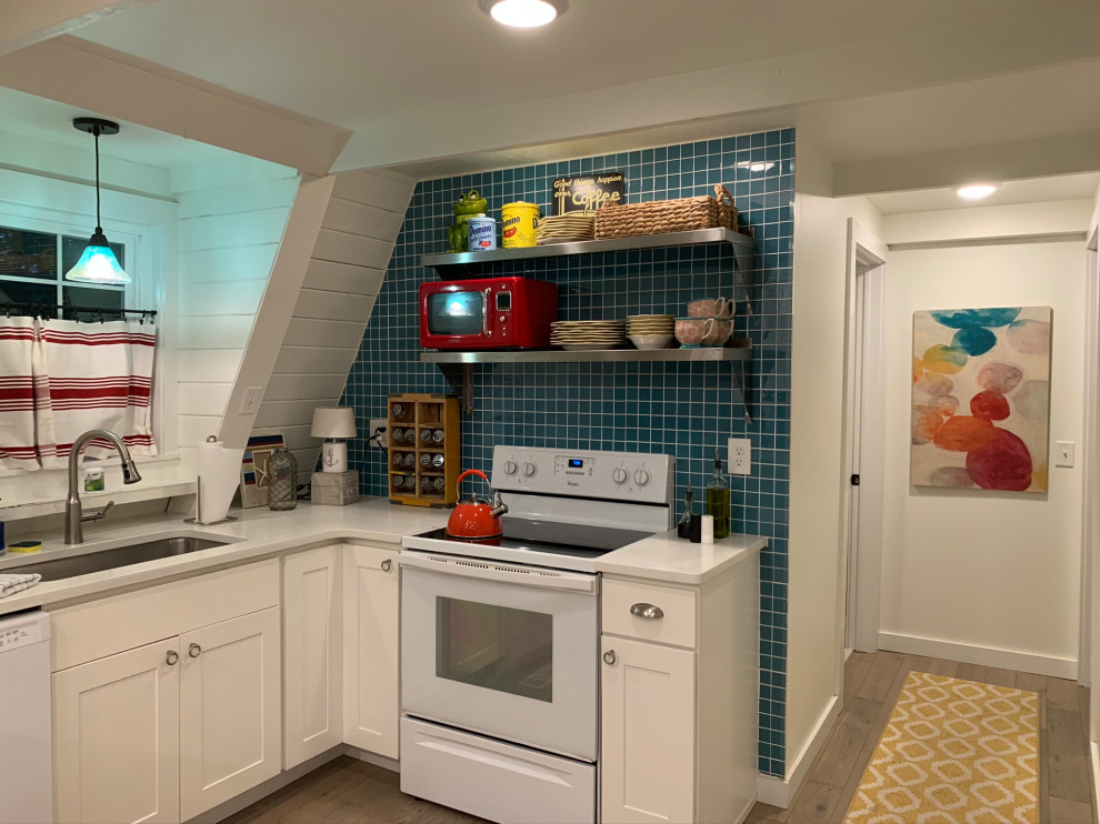 This is an example of a medium sized coastal u-shaped kitchen/diner in DC Metro with white appliances, white worktops and a wood ceiling.