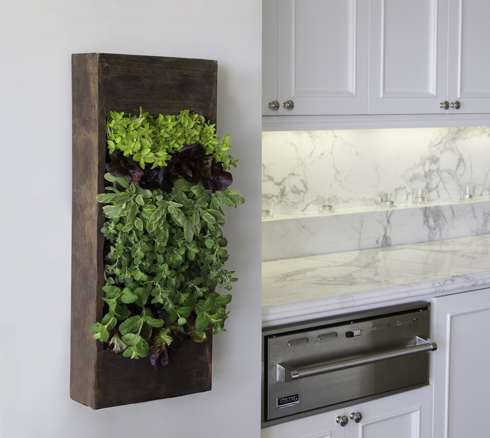 Kitchen - contemporary kitchen idea in Los Angeles with recessed-panel cabinets, stainless steel appliances, marble countertops, white cabinets, white backsplash and stone slab backsplash