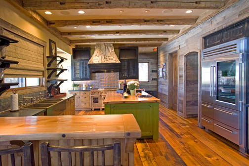Example of a huge mountain style u-shaped medium tone wood floor eat-in kitchen design in Phoenix with a farmhouse sink, flat-panel cabinets, medium tone wood cabinets, wood countertops, metallic backsplash, metal backsplash, stainless steel appliances and an island