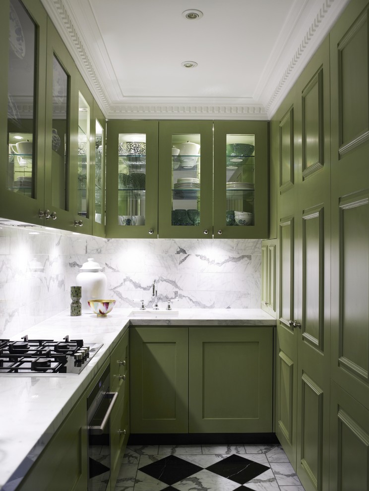 Trendy u-shaped multicolored floor enclosed kitchen photo in Sydney with glass-front cabinets, green cabinets, white backsplash and marble backsplash