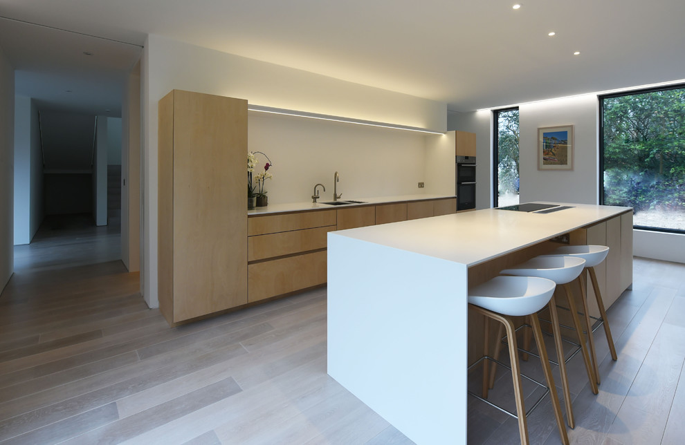 This is an example of a scandi kitchen in Surrey.