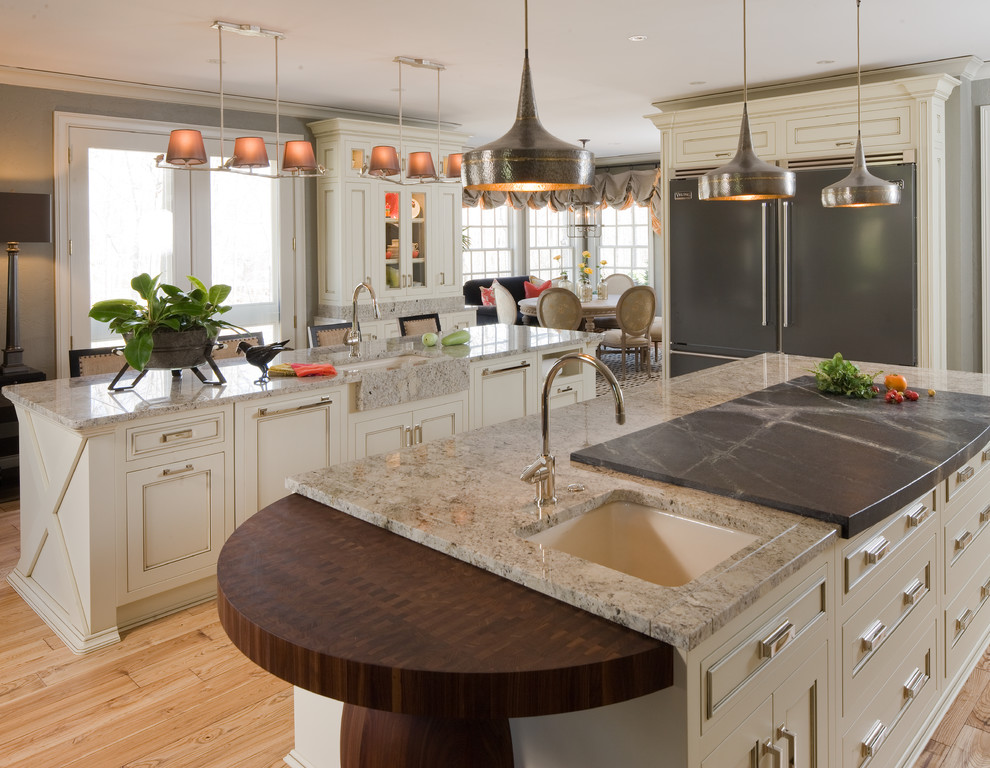 This is an example of a traditional kitchen in Indianapolis with a submerged sink, beige cabinets and granite worktops.