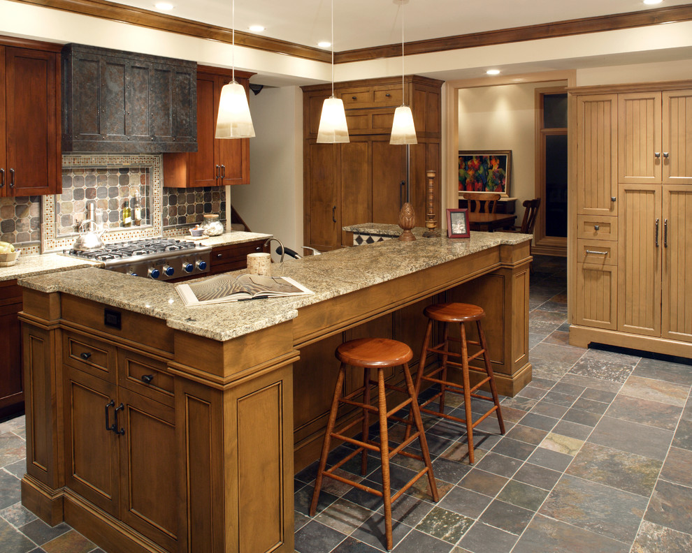 Classic kitchen in Omaha with granite worktops.