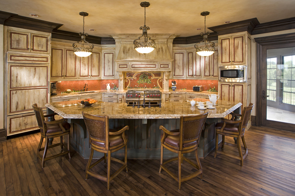 Classic kitchen in Minneapolis with mosaic tiled splashback, stainless steel appliances and orange splashback.