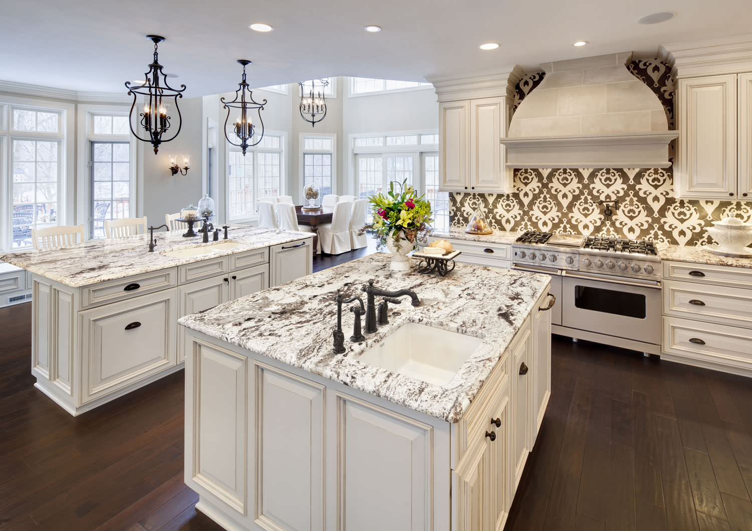 The kitchen features granite countertops, electric appliances, and