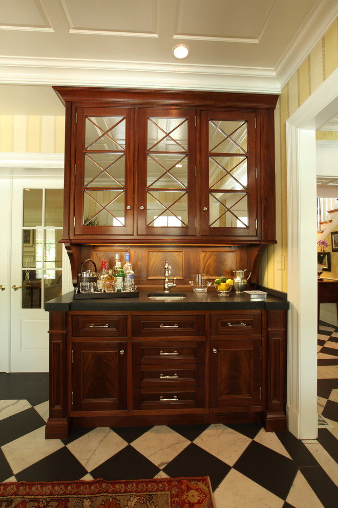 Elegant kitchen photo in Louisville with an undermount sink and dark wood cabinets