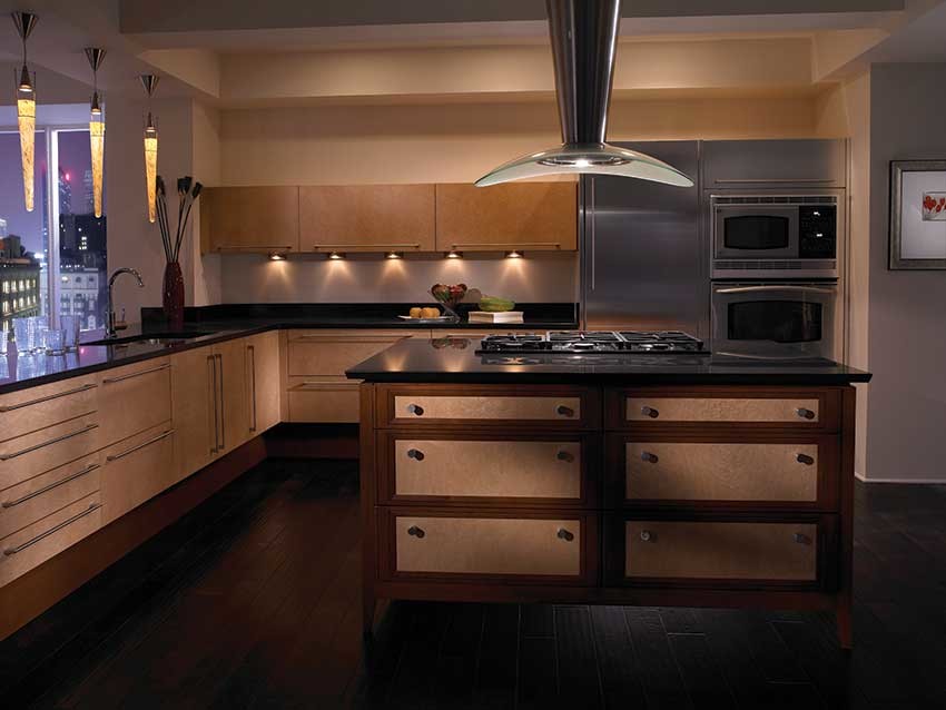 Example of a mid-sized trendy u-shaped dark wood floor eat-in kitchen design in Jackson with an undermount sink, flat-panel cabinets, light wood cabinets, solid surface countertops, stainless steel appliances and an island
