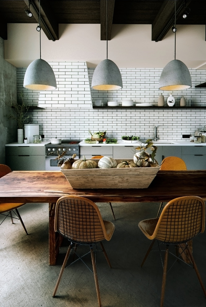 Inspiration for a medium sized contemporary single-wall kitchen/diner in Detroit with a submerged sink, flat-panel cabinets, grey cabinets, composite countertops, white splashback and stone tiled splashback.