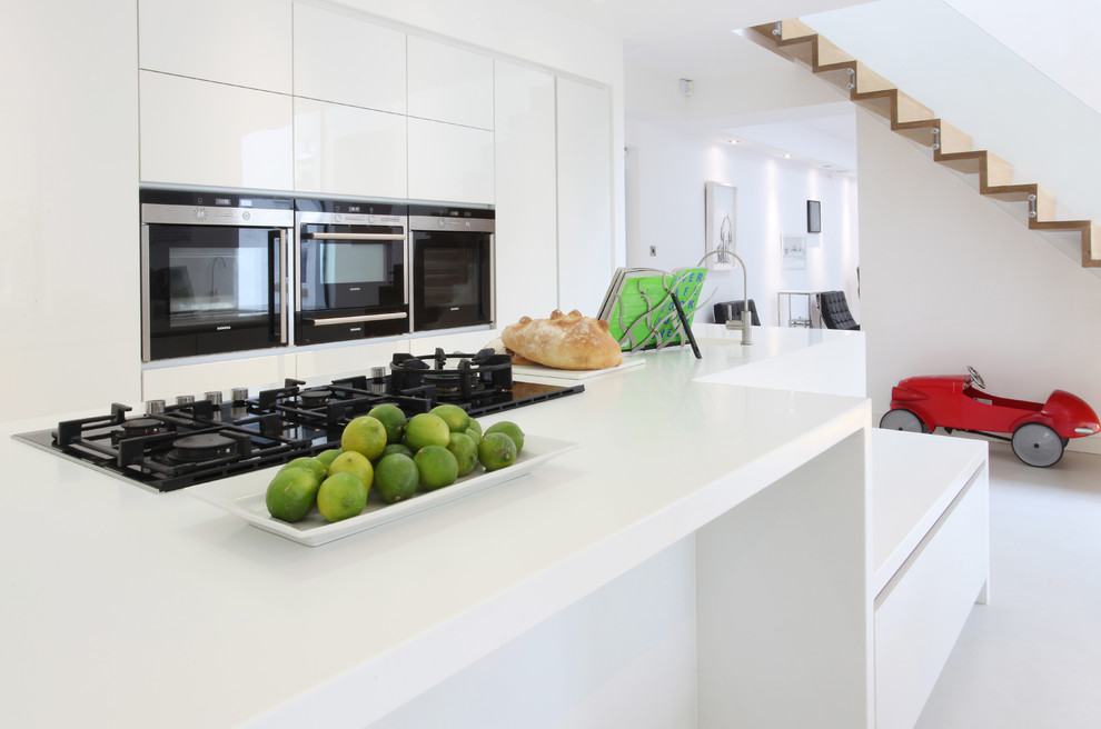Photo of a large contemporary open plan kitchen in Manchester with an island.