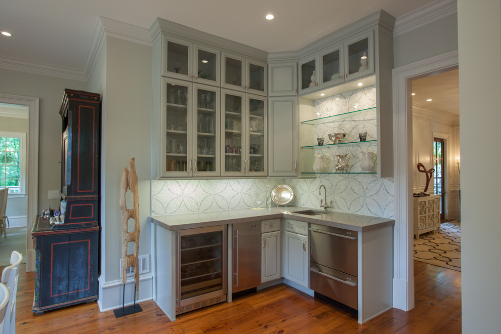 Example of a classic kitchen design in Atlanta with an undermount sink, glass-front cabinets, gray cabinets, multicolored backsplash and stainless steel appliances