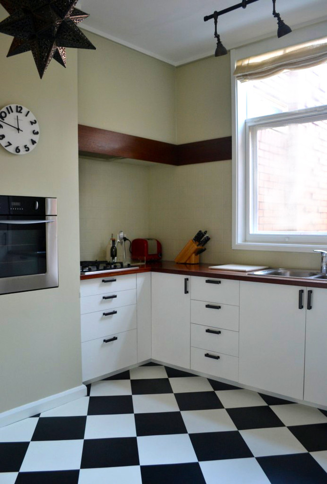 Example of an eclectic kitchen design in Melbourne