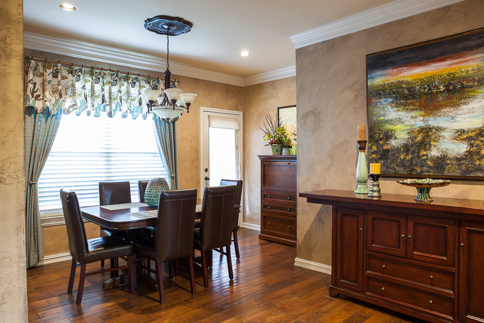 Large elegant medium tone wood floor kitchen/dining room combo photo in Dallas