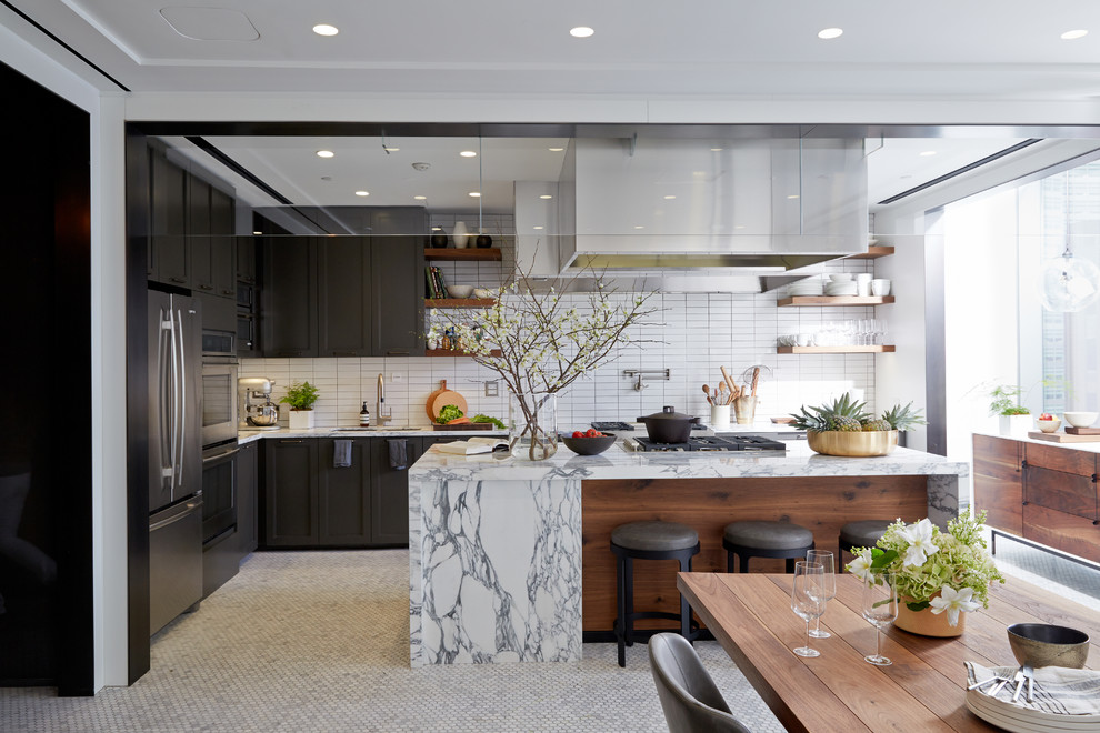 Example of a huge transitional l-shaped ceramic tile eat-in kitchen design in San Francisco with a double-bowl sink, shaker cabinets, brown cabinets, marble countertops, white backsplash, subway tile backsplash, stainless steel appliances and an island