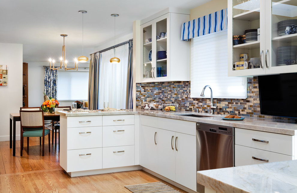 Example of a mid-sized 1950s l-shaped light wood floor enclosed kitchen design in San Francisco with a drop-in sink, glass-front cabinets, white cabinets, marble countertops, multicolored backsplash, mosaic tile backsplash, stainless steel appliances and an island