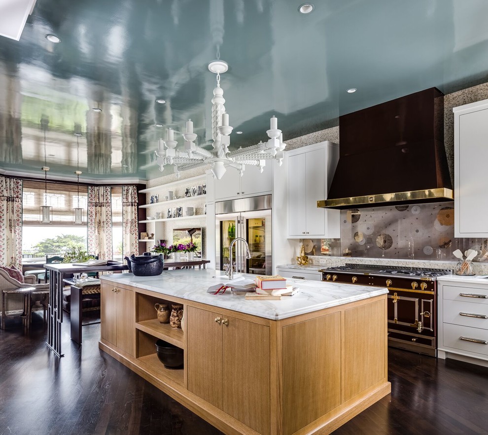 Large transitional single-wall dark wood floor and brown floor open concept kitchen photo in Boston with flat-panel cabinets, white cabinets, multicolored backsplash, black appliances, an island, marble countertops and glass sheet backsplash