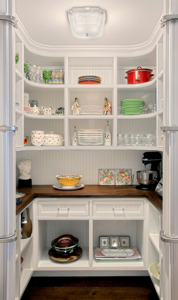 Inspiration for a timeless u-shaped kitchen pantry remodel in Chicago with open cabinets, white cabinets and wood countertops